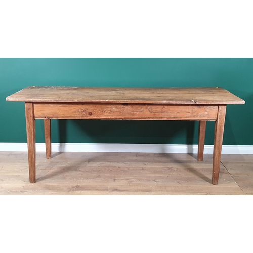 657 - A rustic pine Kitchen Table with rectangular three plank top, with deep frieze, raised on square tap... 