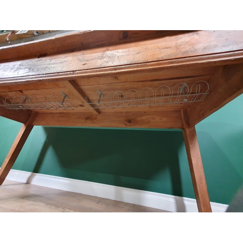 657 - A rustic pine Kitchen Table with rectangular three plank top, with deep frieze, raised on square tap... 