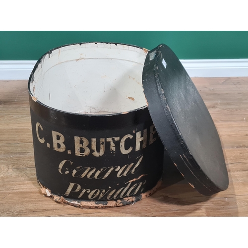 7 - An oval black Storage Box and Cover painted C.B Butcher, General Provider, 2ft (R2)