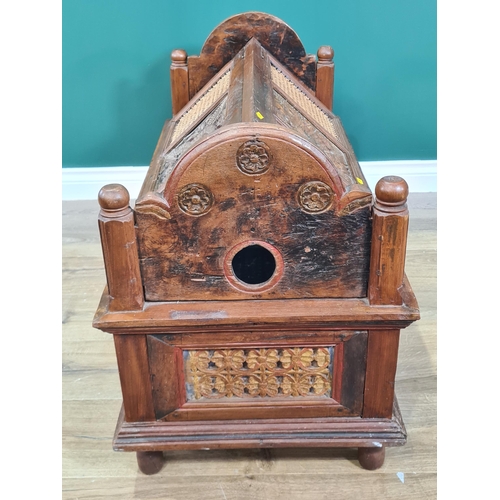 746 - A continental hardwood Hutch/Crib with carved shaped ends, canework and carved panelled lid and side... 