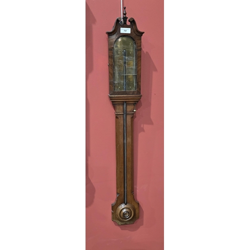 797 - A 19th Century mahogany Stick Barometer with swan neck pediment above the arched brass dial (glass c... 