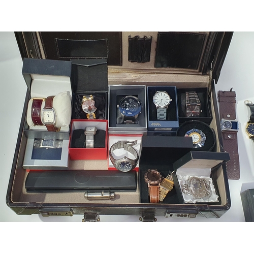 268 - A briefcase containing a collection of modern mostly quartz gentleman's Wristwatches