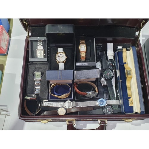 269 - Two briefcases containing a collection of modern mostly quartz gentleman's Wristwatches