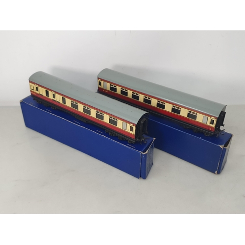 1038 - A scarce pair of Hornby Dublo D12 BR Coaches with LMS bogies in correct early dark blue boxes, M, bo... 