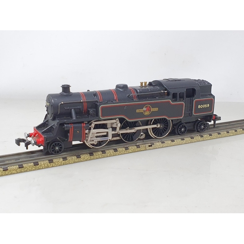 1059 - A boxed Hornby Dublo 3218 2-6-4T with rare forward facing emblems, M, showing no signs of use, box E... 