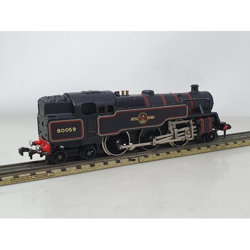 1059 - A boxed Hornby Dublo 3218 2-6-4T with rare forward facing emblems, M, showing no signs of use, box E... 