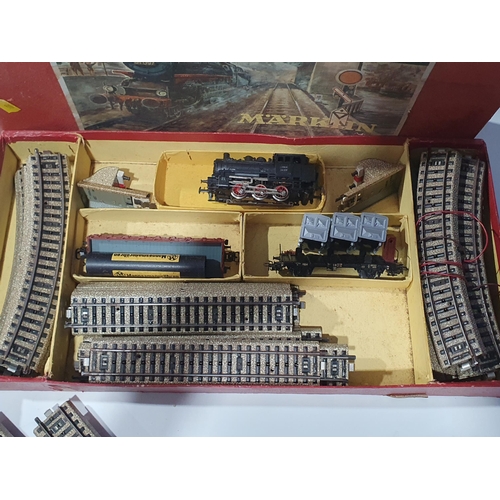 1263 - A boxed Marklin HO scale 0-6-0T Goods Set, a boxed Bo-Bo diesel Locomotive, two boxed Coaches, five ... 