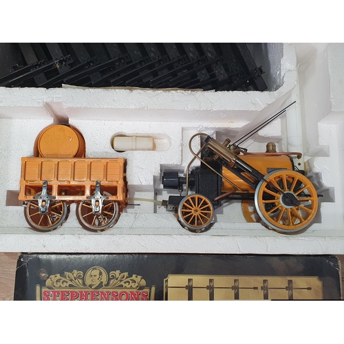 1283 - A boxed Hornby 3 1/2in gauge live steam Stephenson's Rocket Set in unused condition, box F, two Coac... 