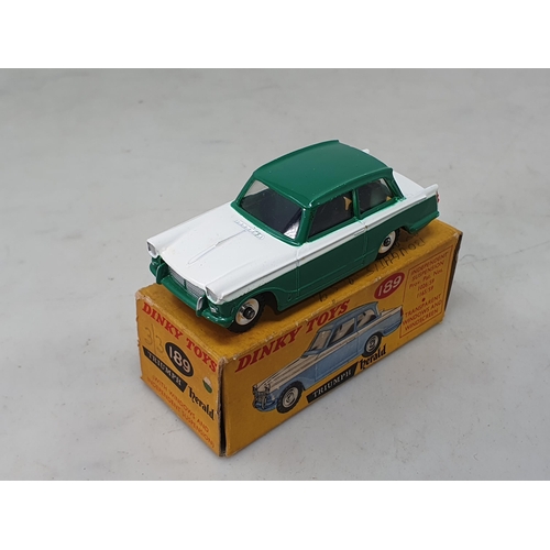 1303 - A boxed Dinky Toys No.189 green and white Triumph Herald, Ex plus, box VG