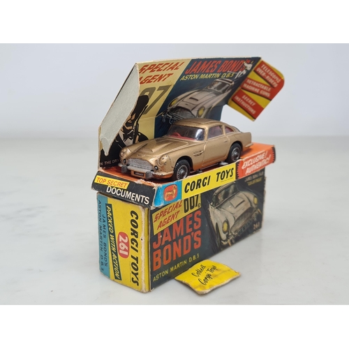 1359 - A boxed Corgi Toys No.261 James Bond 007 Aston Martin D.B.5, G, box G (missing end flap), complete w... 