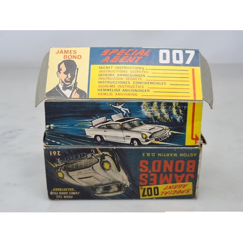 1359 - A boxed Corgi Toys No.261 James Bond 007 Aston Martin D.B.5, G, box G (missing end flap), complete w... 