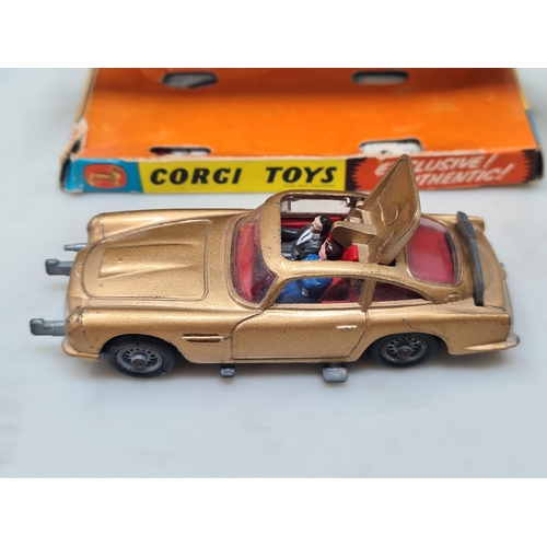 1359 - A boxed Corgi Toys No.261 James Bond 007 Aston Martin D.B.5, G, box G (missing end flap), complete w... 