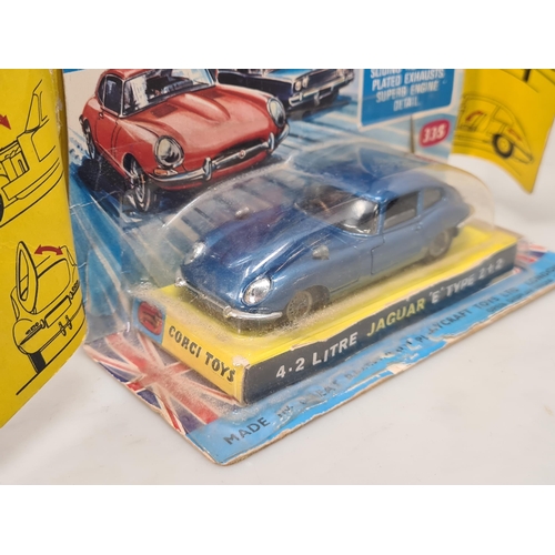 1366 - A boxed Corgi Toys No.335 dark blue Jaguar 'E' Type 2+2, Nr M, box G