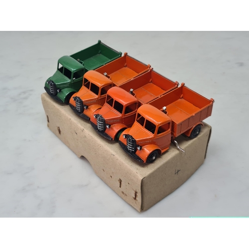 1392 - A Dinky Toys Trade Box 25M Bedford End Tipper with four models, Nr M-M, box Ex plus