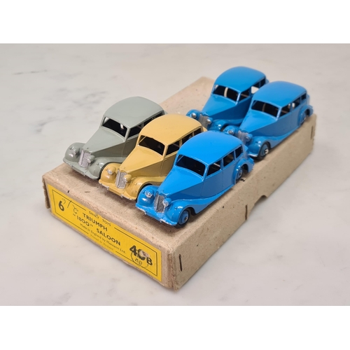 1394 - A Dinky Toys Trade Box 40B Triumph 1800 Saloons containing one buff, one grey and three blue models,... 