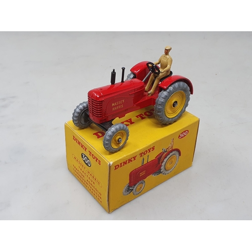 1411 - A boxed Dinky Toys No.300 Massey-Harris Tractor, M, box Ex pus with packing