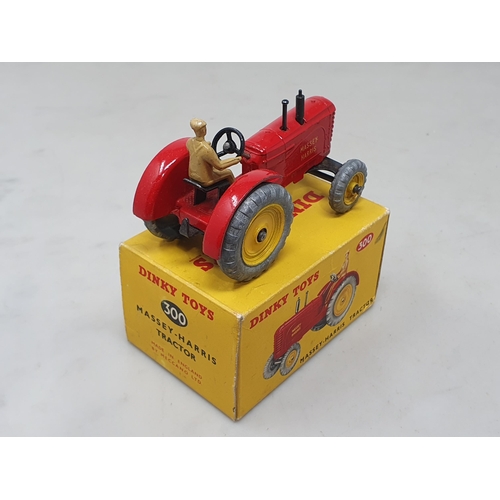 1411 - A boxed Dinky Toys No.300 Massey-Harris Tractor, M, box Ex pus with packing