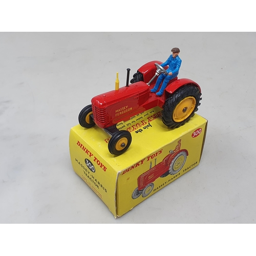 1413 - A boxed Dinky Toys No.300 Massey-Harris Tractor with plastic driver, M, box Nr perfect