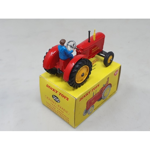 1413 - A boxed Dinky Toys No.300 Massey-Harris Tractor with plastic driver, M, box Nr perfect