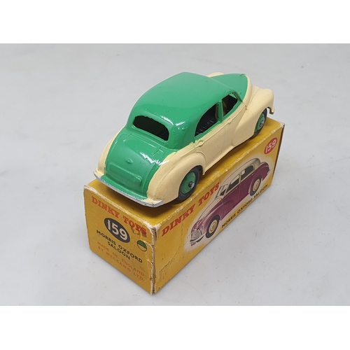 1419 - A boxed Dinky Toys No.159 green over cream Morris Oxford Saloon, M, box VG-Ex