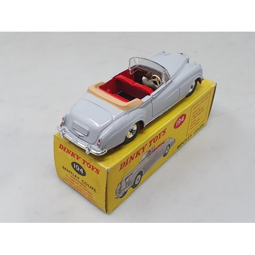 1421 - A rare boxed Dinky Toys No.194 grey Bentley Coupe with red interior, Nr M-M, box Ex plus