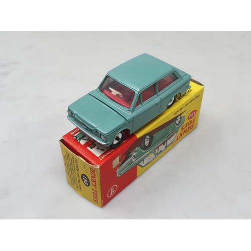 1426 - A boxed Dinky Toys No.138 metallic green Hillman Imp with red interior, Nr M-M, box Ex plus