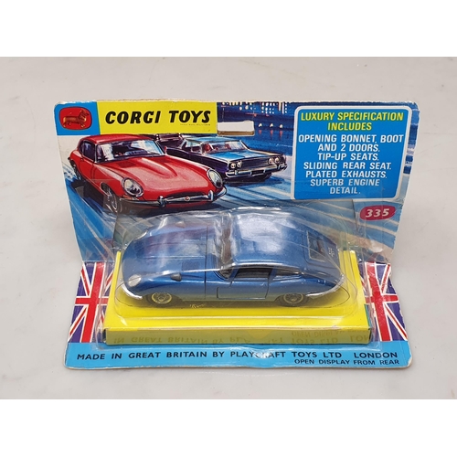 1494 - A boxed Corgi Toys No.335 blue Jaguar E-type in blister pack, Ex, box Ex plus