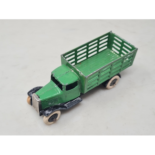 1517 - A scarce Dinky Toys No.25c green Farm Produce Wagon with tin grille, VG (some paint wear and crackin... 