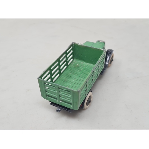 1517 - A scarce Dinky Toys No.25c green Farm Produce Wagon with tin grille, VG (some paint wear and crackin... 