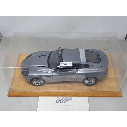 1551 - A Danbury Mint 1:12 scale limited edition James Bond Aston Martin Vanquish, with certificate of auth... 