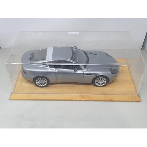 1551 - A Danbury Mint 1:12 scale limited edition James Bond Aston Martin Vanquish, with certificate of auth... 