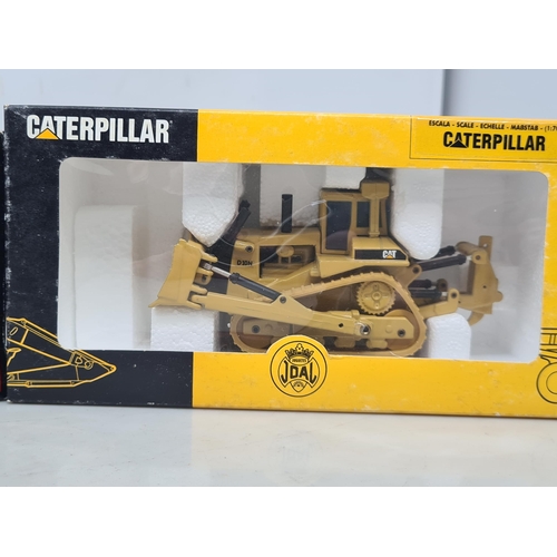 1579 - A boxed Joal Caterpillar Train Tractor and a boxed Ertl9030B Excavator