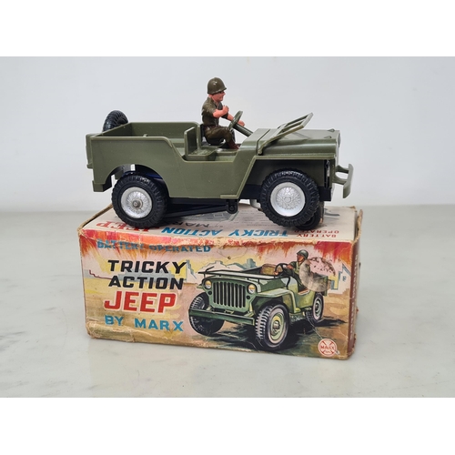 1626 - A boxed Marx battery operated Tricky Action Jeep, complete with figure, Ex, box G