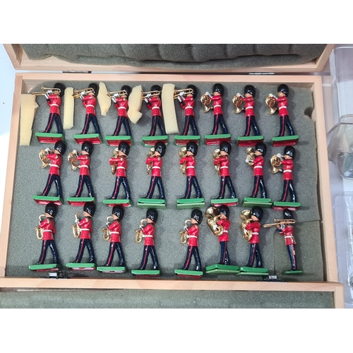 1590 - Four wooden Cases of unboxed modern issue Britains Guards and R.A.F. Bandsmen, a box of historic mil... 