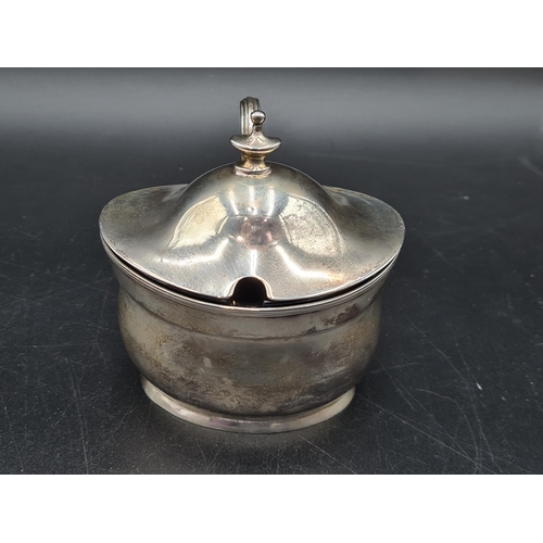 104 - A George III silver oval Mustard Pot, the hinged cover with urn finial, London 1800