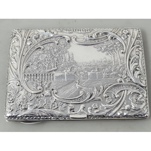 106 - A Victorian silver Card Case finely embossed and chased with formal garden scene within floral and s... 