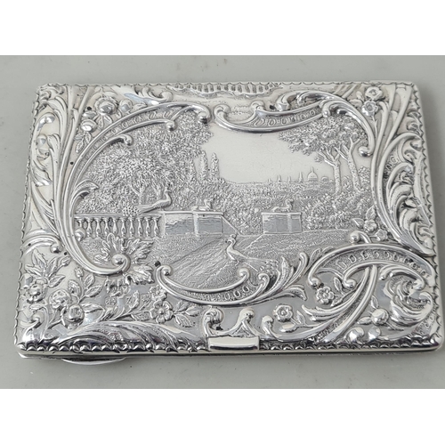 106 - A Victorian silver Card Case finely embossed and chased with formal garden scene within floral and s... 