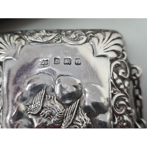 118 - An Edward VII silver Purse or card Case embossed cherub masks and scrolls, Birmingham 1906, maker: C... 