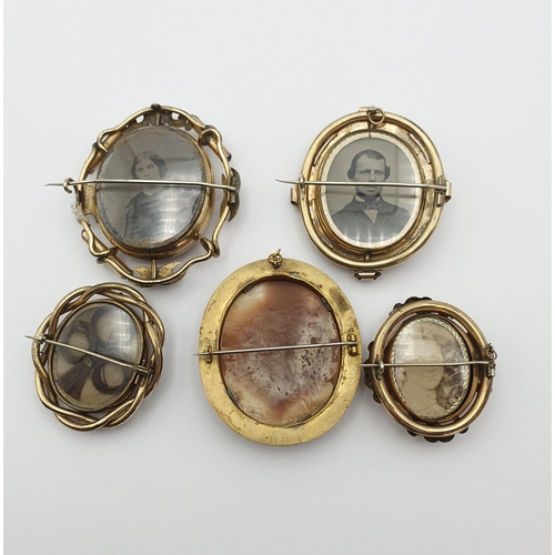 25 - A group of five Shell Cameo Victorian Mourning Brooches, four of them with swivel parts