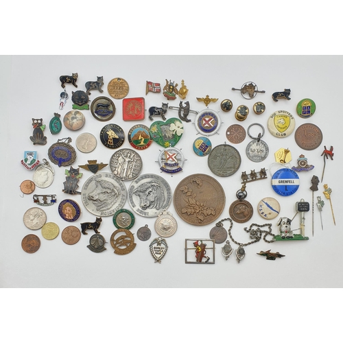 44 - A large collection of vintage and earlier Badges, Pins and Commemorative Coins including Isle of Man... 