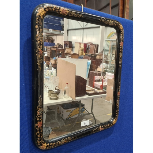 60 - A Chinoiserie Mirror with gilt floral decoration on a black ground