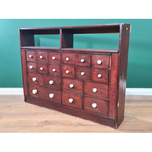 62 - A bank of twenty stained Apothecary Drawers with pigeon hole type top section, 3ft High x 4ft 1