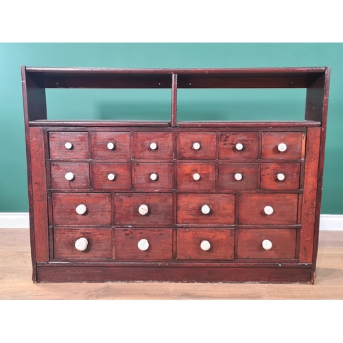 62 - A bank of twenty stained Apothecary Drawers with pigeon hole type top section, 3ft High x 4ft 1