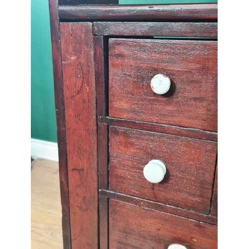 62 - A bank of twenty stained Apothecary Drawers with pigeon hole type top section, 3ft High x 4ft 1