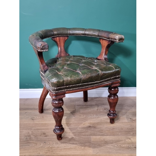 63 - A green button upholstered mahogany framed Captain type Elbow Chair raised on thick turned front sup... 