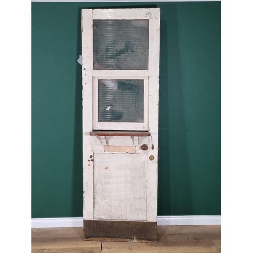 66 - A white painted glazed Pub Door with glazed sliding hatch, 86