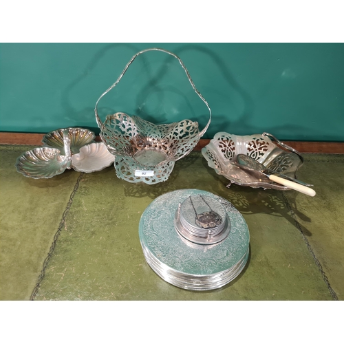 82 - A modern silver Sherry label, two plated Cake Baskets, three division Dish, Table Mats and Coasters