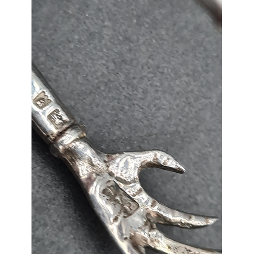 86 - A pair of George V Novelty silver Sugar Tongs with mask and claw design, London 1926