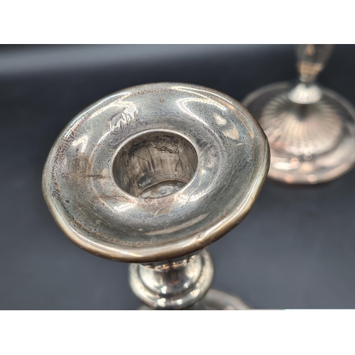 92 - A pair of George III silver Candlesticks with baluster columns, engraved initials on circular bases,... 