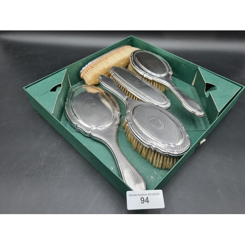 94 - A George V silver mounted five piece Dressing Table Set with honeycomb design and engraved initials,... 